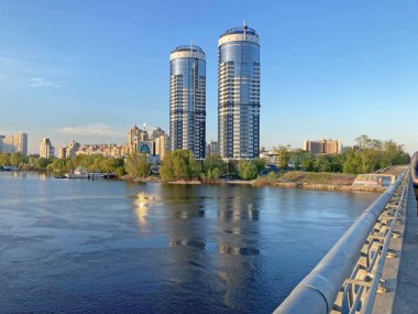 Residential complex Sunny riviera. Two modern luxury skyscrapers against blue sky. Concept of modern architecture from glass, steel and concrete. Kyiv, Ukraine-March 21, 2022