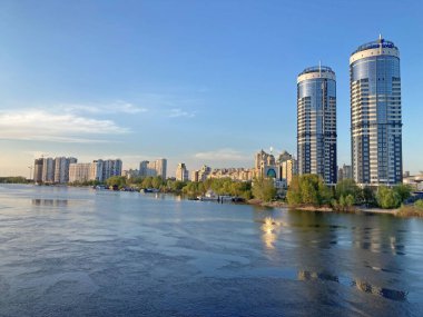 Residential complex Sunny riviera. Two modern luxury skyscrapers against blue sky. Concept of modern architecture from glass, steel and concrete. Kyiv, Ukraine-March 21, 2022