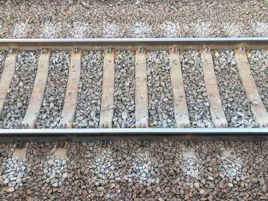 Railway rails and sleepers view from above close up