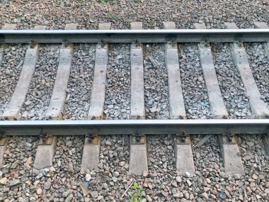 Railway rails and sleepers view from above close up