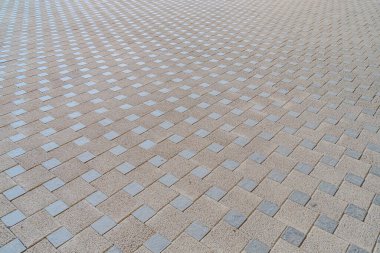 Döşeme taşlarının dokusu. Asfalt döşenmiş bir yol. Fotoğrafı yakından çek. Boşluğu kopyala.