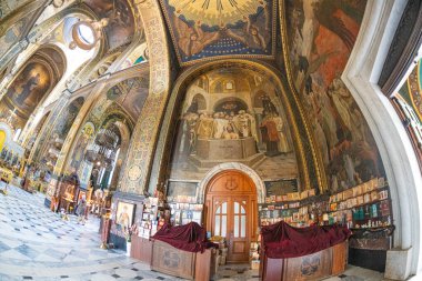 Interior of the St. Volodymyr's Cathedral with altar and fragments of frescoes Interior of the famous St. Volodymyr Cathedral with icons and painting frescoes on the wall KIEV, UKRAINE 08-04-2024 clipart