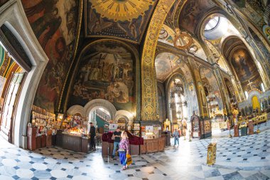 Interior of the St. Volodymyr's Cathedral with altar and fragments of frescoes Interior of the famous St. Volodymyr Cathedral with icons and painting frescoes on the wall KIEV, UKRAINE 08-04-2024 clipart