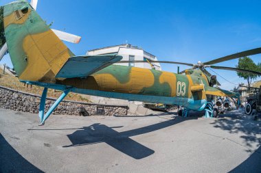 Mil Mi-24 large gunship and attack helicopter at the museum. Soviet military helicopter Mi-24 at National Museum of Ukrainian History in the Second World War. Kyiv, Ukraine 10-29-2024. clipart