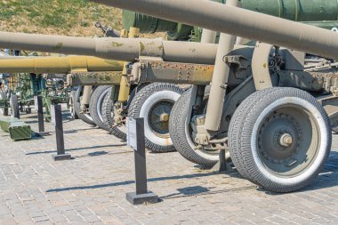 Artillery guns for Ukraine. Part of the exposition of Ukrainian arms. Russian-Ukrainian war. Kyiv, Ukraine 10-29-2024. clipart