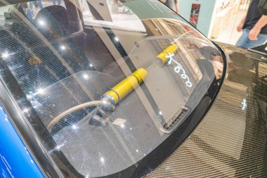 A close-up view of the rear section of an electric vehicle, showcasing its aerodynamic design with dark blue tones and lighter blue highlights, featur Kyiv, Ukraine 06-06-2024 clipart