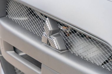 A close-up view of the front grille and part of the hood of a vehicle is shown, with parallel bars and horizontal slits dominating the design The cen Kyiv, Ukraine 06-06-2024 clipart