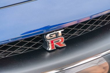 The image shows a close-up of the rear section of a high-performance car, focusing on its GT-R badge with stylized font and carbon fiber bodywork T Kyiv, Ukraine 06-06-2024 clipart