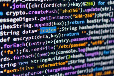 Trojan. A close-up of a computer screen displaying colorful text with encryption codes data, encrypt, decrypt, SHA256, potential security issues trojan, attack, and an indoor setting with ambient lightin clipart