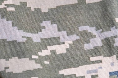 This high-quality image showcases a seamless camouflage pattern inspired by military designs. Featuring a mix of earth tones, dark greens, and muted grays, this realistic pattern is perfect for outdoo clipart