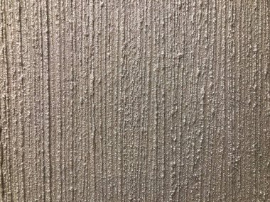 Yumuşak ışıkla aydınlatılan açık gri bej kumaş desenli, desenli, paralel ya da müzikal notanın yakın görüntüsü zanaatkarlık ve detaylara odaklan