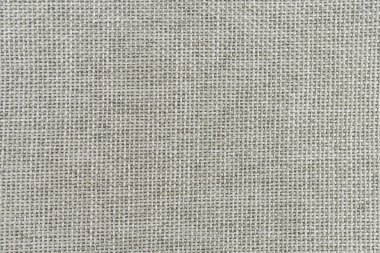 Moda, iç tasarım ve tekstil üretimi gibi çeşitli uygulamalar için uygun, pürüzsüz desenli ince dokunmuş bir kumaşın yakın plan görüntüsü