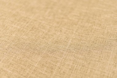 Görüntü, elbise, yatak ve döşeme gibi moda ürünlerini pazarlamak için uygun ince dokuma desenli, açık tenli ya da bej kumaşlı yakın çekim görüntüler sergiliyor.