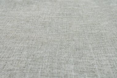 Lüks ve rahatlık hissi uyandıran, iç döşemelere ve giysilere uygun ince desenli üst düzey, dokulu kumaş görüntüsü.