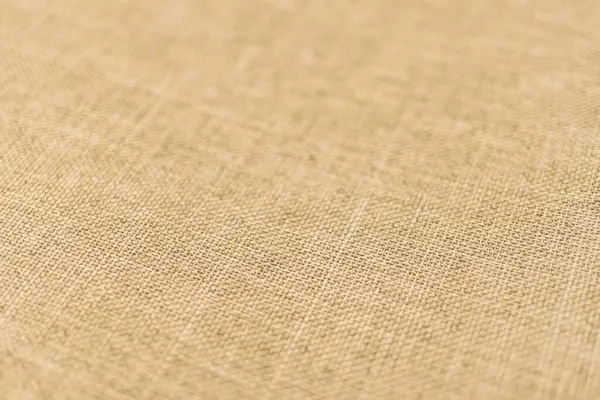 Görüntü, elbise, yatak ve döşeme gibi moda ürünlerini pazarlamak için uygun ince dokuma desenli, açık tenli ya da bej kumaşlı yakın çekim görüntüler sergiliyor.