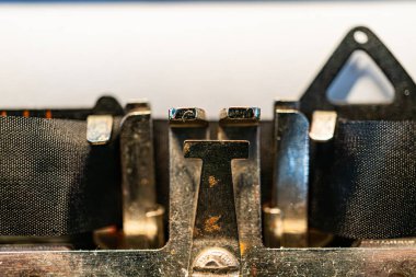 Close-up image of a vintage mechanical typewriters typebar assembly, showcasing gold bars and craftsmanship a clipart