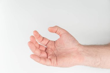 Açık tenli bir elin yan yatmış, avuç içi yukarıda, hafifçe kıvrılmış parmaklar.