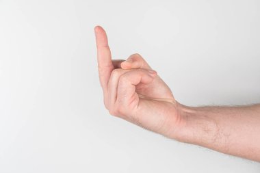 Genişletilmiş bir elin yakın çekimi, düz bir yüzey ya da duvarda gölgesi, dağınık gölgeli kapalı bir ışıklandırma görünür bir metin yok, samimi bir tarz