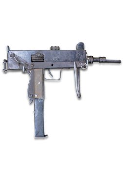 Görünür mekanik parçaları olan eski, paslı bir makineli tüfek. a