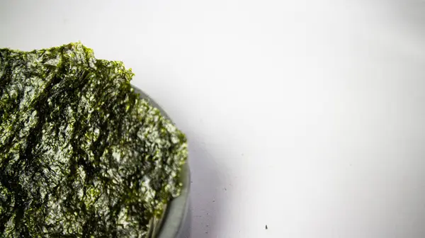 stock image Crispy nori seaweed on bowl with white background. Japanese dry seaweed sheets.