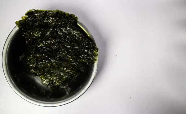 stock image Crispy nori seaweed on bowl with white background. Japanese dry seaweed sheets.