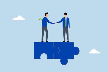 İşbirlikçi, başarılı girişimciler anlaşmayı tamamlar ve bir yapboz üzerinde el sıkışırlar.. 