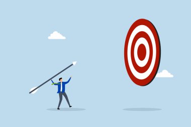 Büyük bir amaç için, girişimci büyük dart okunu fırlatıyor, dart tahtasını hedef alıyor.. 