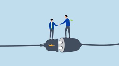 İş bağlantısı, iş ortağı elektrik prizine bağlanırken el sıkışması.