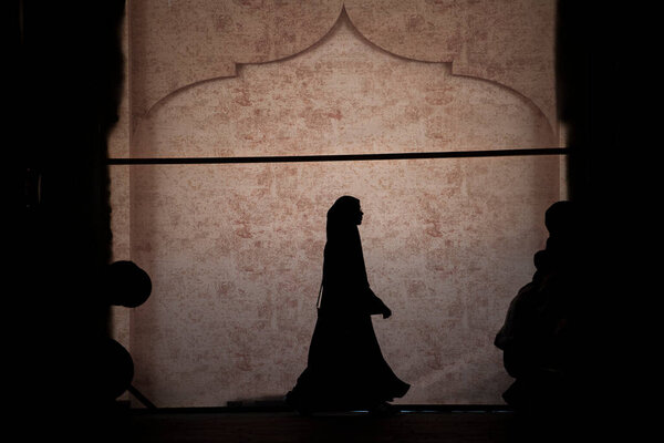 Doha, Qatar- March 05, 2019 : The Qatari family in traditional attire hang out in old bazaar market Souk Waqif.