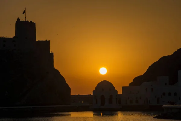 Muscat, Oman - March 05,2019 : View of the Al Jalali fortess at sunrise in the old town Muttrah.