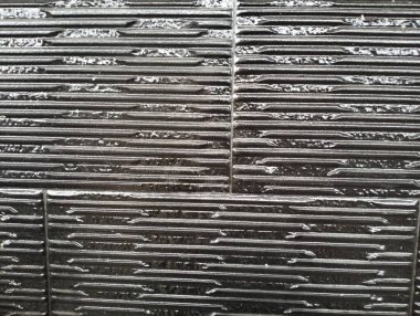 Taş duvarın siyah arkaplanı, siyah taş duvarın dokusu, siyah taş duvar arkaplanı.