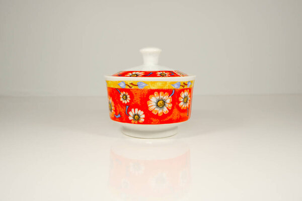 Floral pattern ceramic jar close-up view 