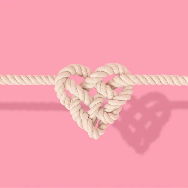 Cuerda Forma Corazón Nudo Sobre Fondo Rosa —  Fotos de Stock