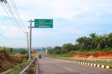 Bengkulu, Indonesia - February 20, 2023 : Signs indicating the way or direction board to the Bengkulu - Taba Penanjung toll road. Bengkulu Toll Road, Indonesia