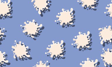 Süt sıçraması mavi arkaplanda izole edilmiş..