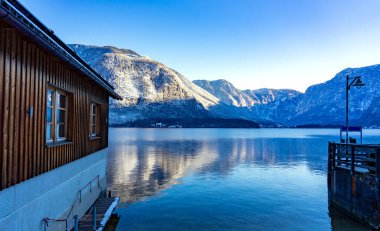 beautiful cityscape of the special city Hallstatt in Austria Salzkammergut snowy winter mountains and lake and wooden details