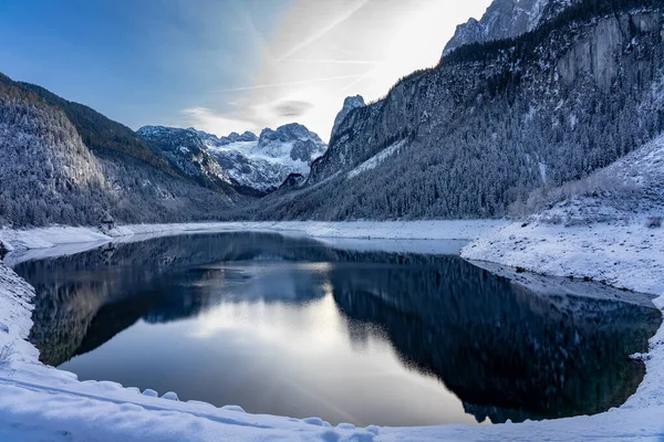 Beautiful snowy winter landscape with Dachstein mountain and Gosausee in Austria near Hallstatt .