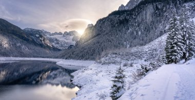 Beautiful snowy winter landscape with Dachstein mountain and Gosausee in Austria near Hallstatt .