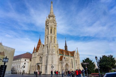 Budapest, Hungary - 01.23.2023: Beautiful Matyas templom Matthias church in Buda castle Budapest with blue sky .