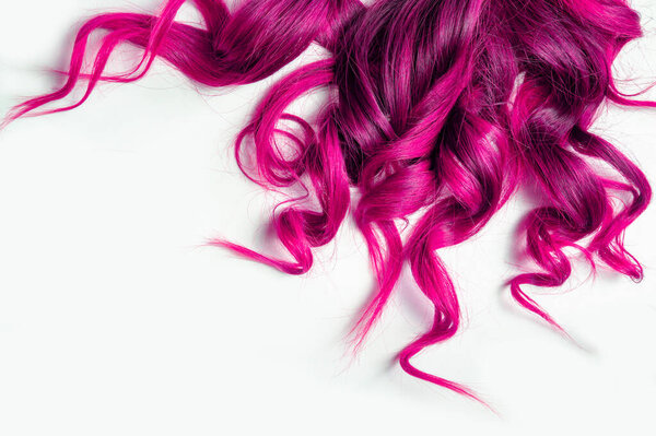 long pink curly hair on isolated white background .