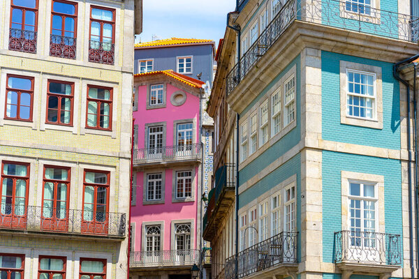 Beautiful colorful building facede in Porto Portugal with azulejo tiles .