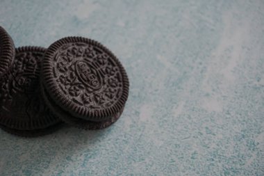Oreo biscuits on a blue and white background