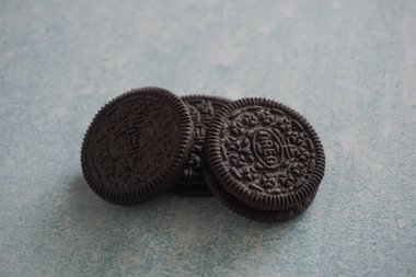 Oreo biscuits on a blue and white background