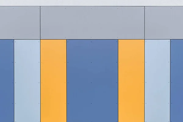 Colorful facade of the object, building. Material of vertical panels.