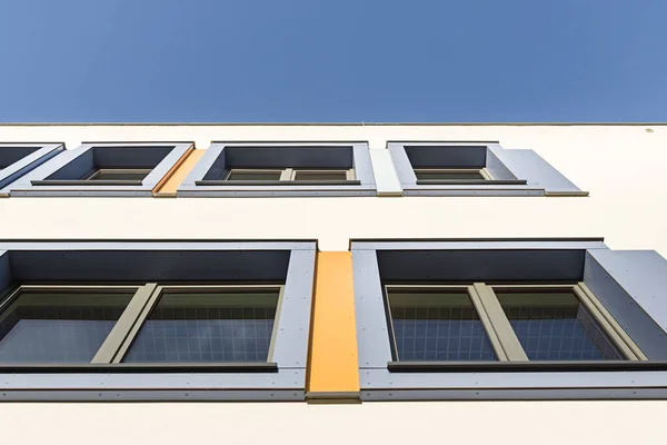 Colorful facade of the object, building. Material of vertical panels. Window cladding.