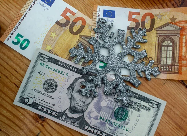 euro and dollar notes in Christmas time