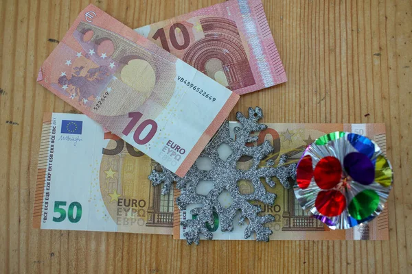 euro bills in Christmas time to pay for presents