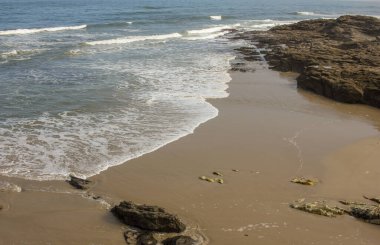 waves lapping a cold Cantabrian beach