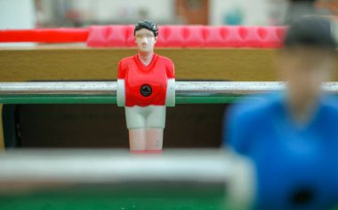 red, table football goal keeper waiting for the ball