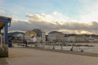 a beach seen from the port of San Cibrao in Spain